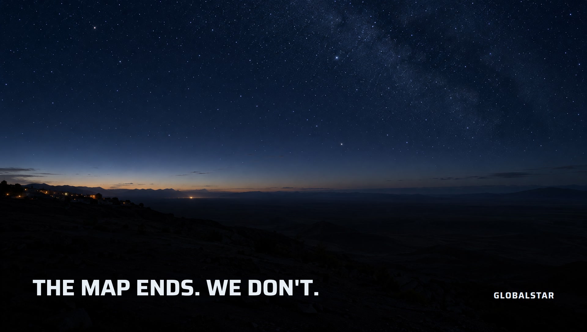 The last town lights giving way to dark wilderness under the Milky Way